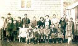 Oysterville School 1911 - Medora sits on bench at far right.